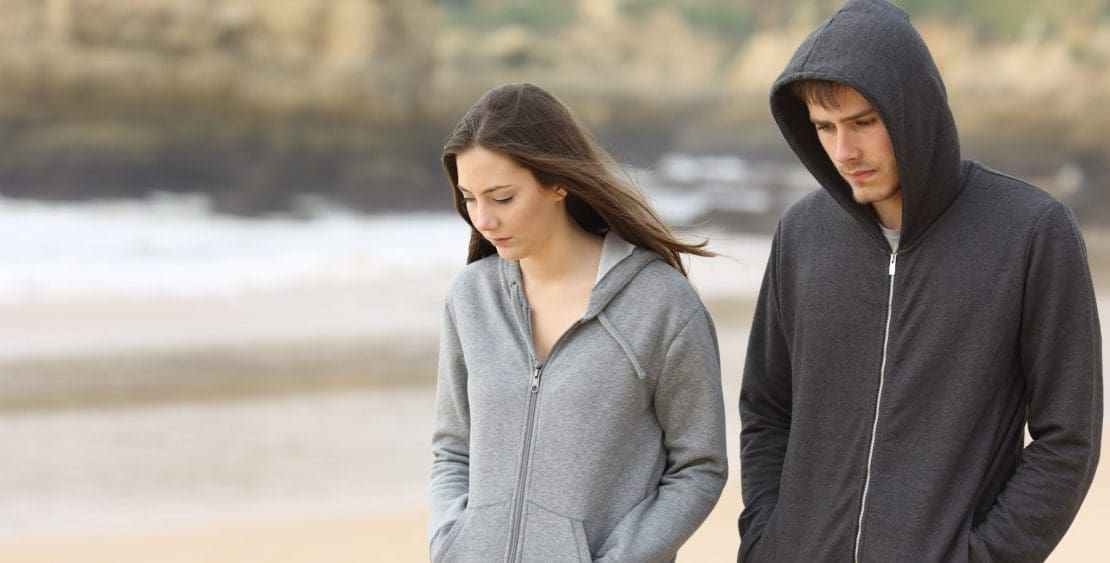 Young couple walking on a beach