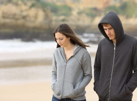 Young couple walking on a beach