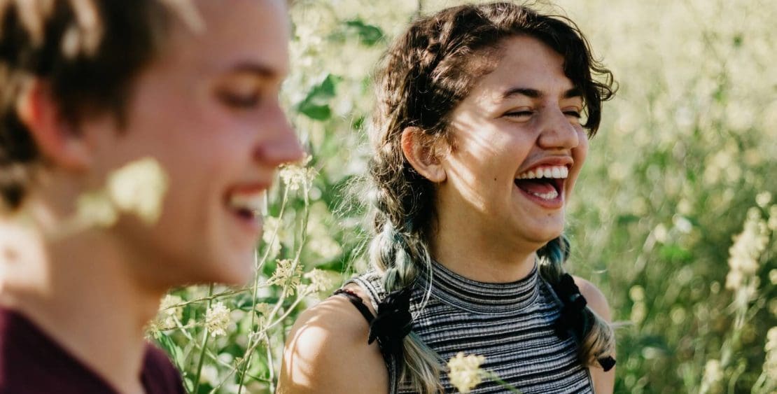 Happy girls in meadow